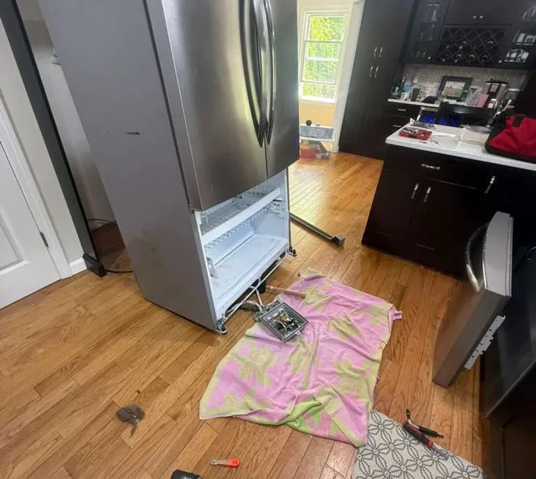 Refrigerator pulled out for a component repair