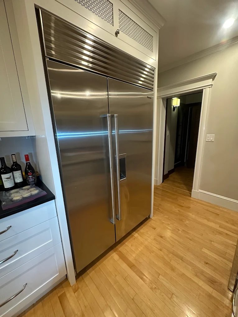 Refrigerator door panel removed for a parts replacement
