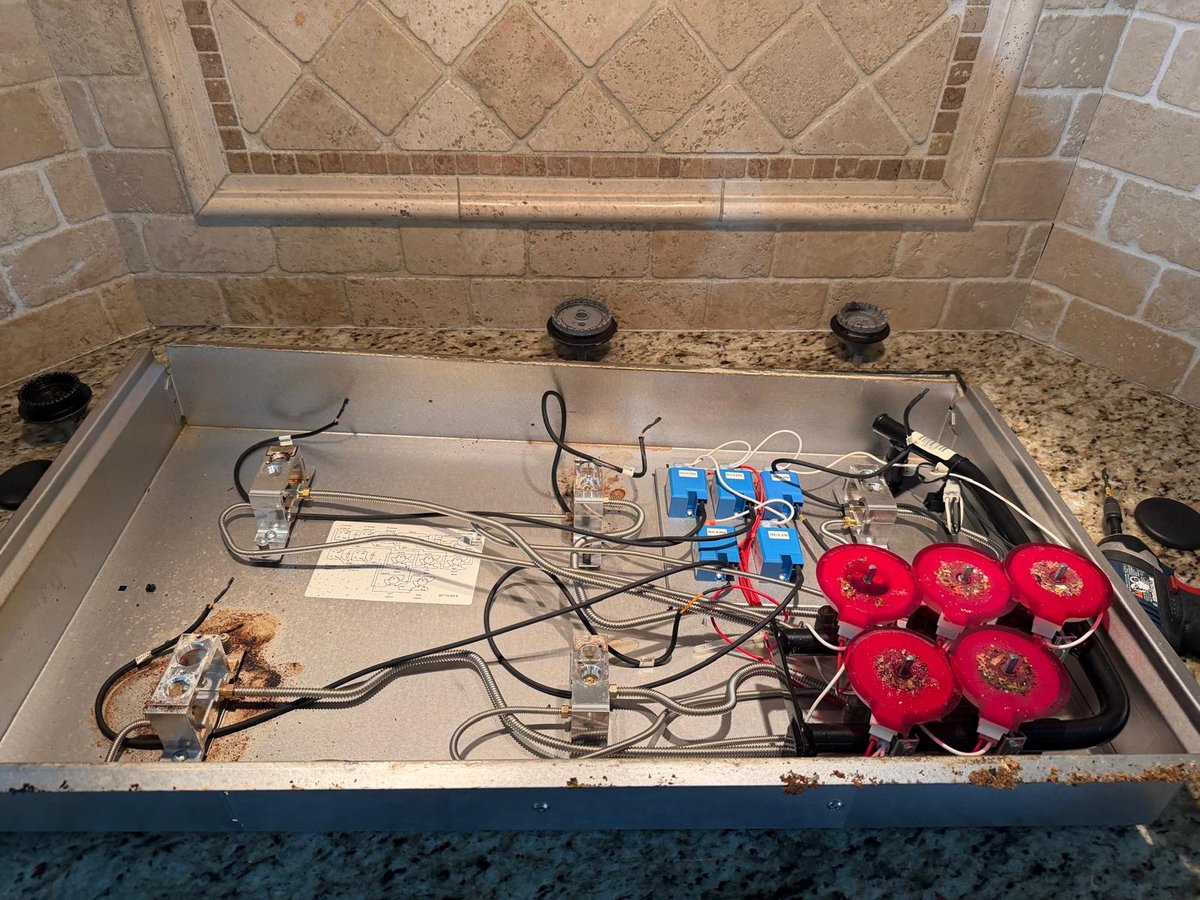 Cooktop wiring inspected during an appliance repair visit